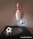 Recycling art bowling pins figure Footballer.