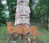 Garden stakes metal sheet riverotter with Moai sculpture.