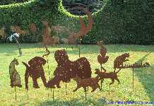 Garden stakes metal sheet rusty cat sitting in the moon.