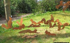 Garden stakes metal-sheet rusty squirrel.
