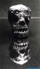 Steel sculpture: The antic of the war. Steel skull - skull.