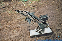 Steel sculpture: Starfighter swinging sculpture.