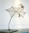 Steel swing sculpture wire gamma spider.